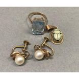 A dress ring set with a step cut blue synthetic spinel, together with a ceramic scarab set pendant