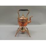 A Victorian copper spirit kettle with turned ebonised handle, the cross frame stand with