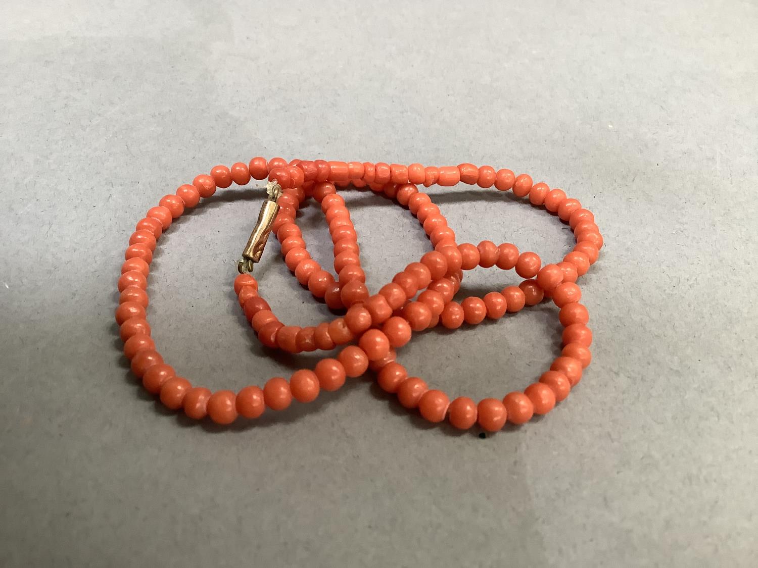An early to mid 20th century coral bead necklace, the graduated roughly spherical beads fastened - Image 3 of 3