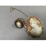 A shell cameo brooch in 9ct gold pierced oval claw setting, together with a shell cameo and garnet