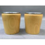 A pair of Linley beech and metal lined candle holders, stamped to the base Linley, 10cm high