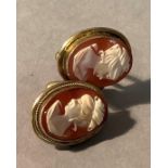A pair of shell cameo cufflinks in 0.800 continental silver gilt, each collet set with an oval