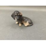 A Royal Copenhagen figure of a Dachshund, no.3140, 7.5cm high