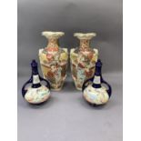Pair of early 20th century Japanese pottery vases, painted in iron red, mocha, ochre and gilt,