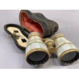 A pair of late Victorian/early 20th century mother-of-pearl and gilt metal opera glasses in original