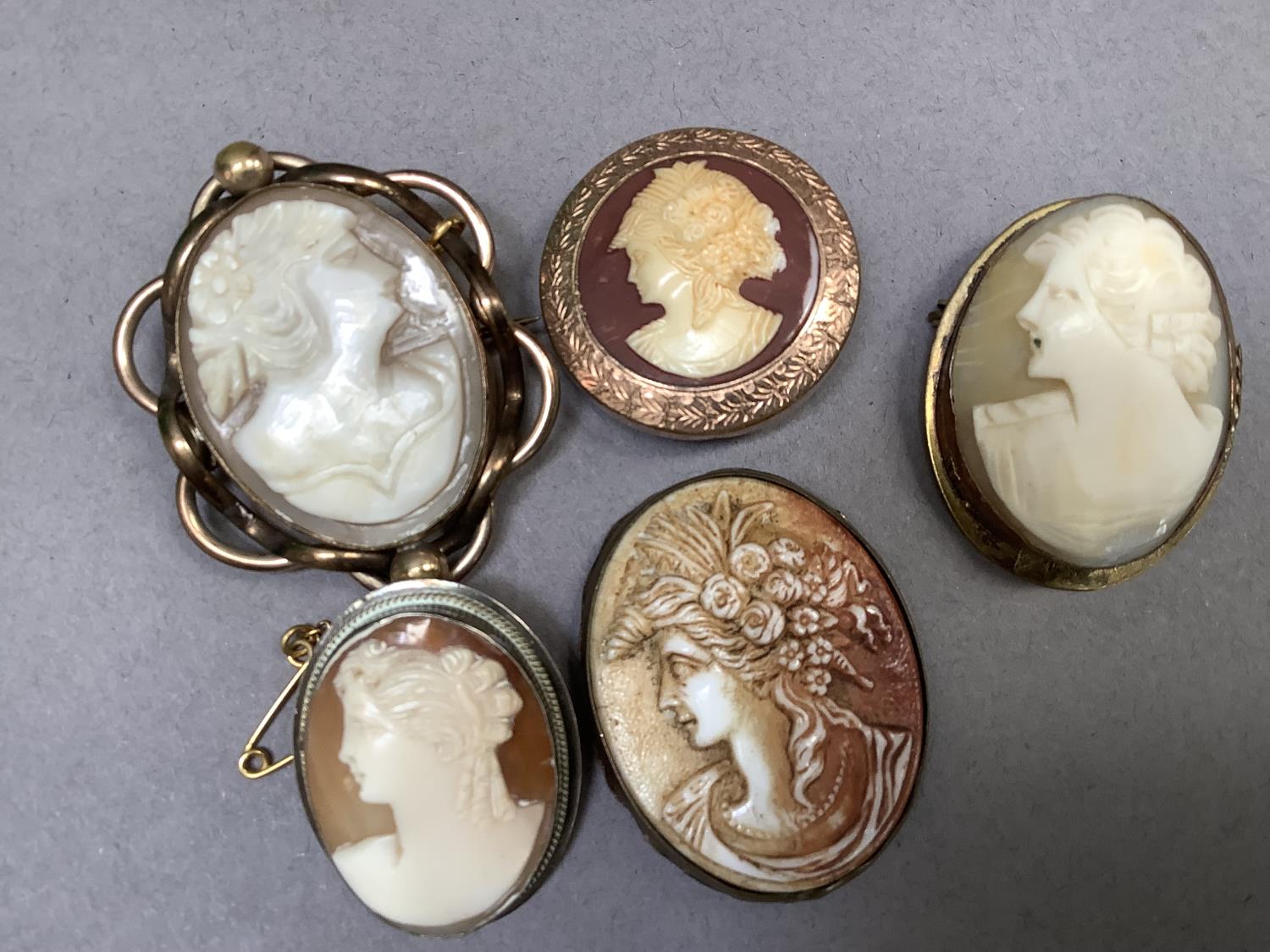 Three shell cameo brooches, c. late 19th century/mid 20th century, two in base metal settings, one - Image 2 of 2