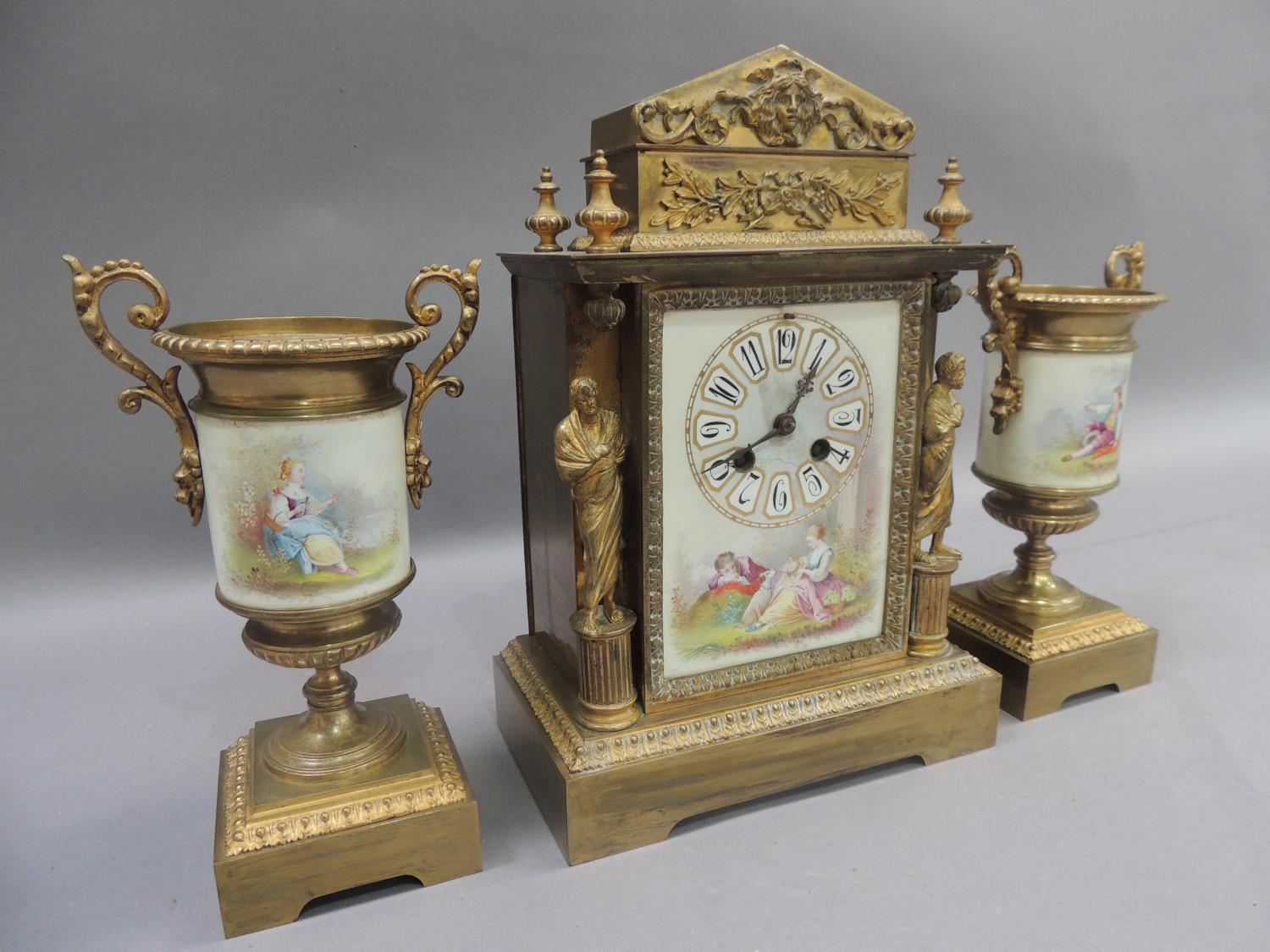 A French gilded brass and porcelain clock garniture, the clock of architectural design with face - Image 2 of 5