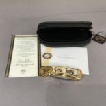 A ten point buck collector knife by Franklin Mint, stainless steel blade, gilt metal frame cast with