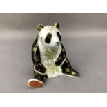 A Royal Crown Derby paperweight giant panda with gold button to underside