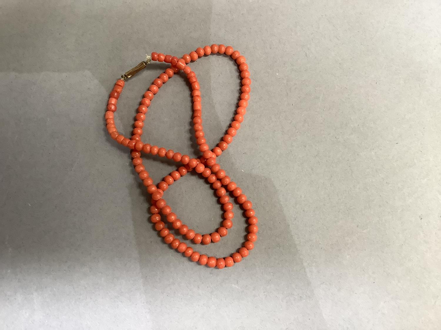 An early to mid 20th century coral bead necklace, the graduated roughly spherical beads fastened - Image 2 of 3