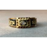 A Victorian diamond and enamel set mourning ring in 15ct gold, the small Old European cut stone