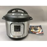 An Instantpot Duo pressure cooker with manual, as new