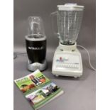 A Nutri-Bullet Magic Bullet with manual, together with an Osterizer blender