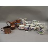 Two 19th century copper lustre jugs and a mug together with two Gaudy Welsh jugs, a cup and