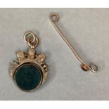 A Victorian 9 carat gold spring fob collet set with circular seed cut bloodstone and cornelian