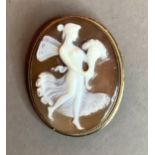 A shell cameo brooch/pendant c.1960, the oval portrait of Ceres, collet set within a silver gilt