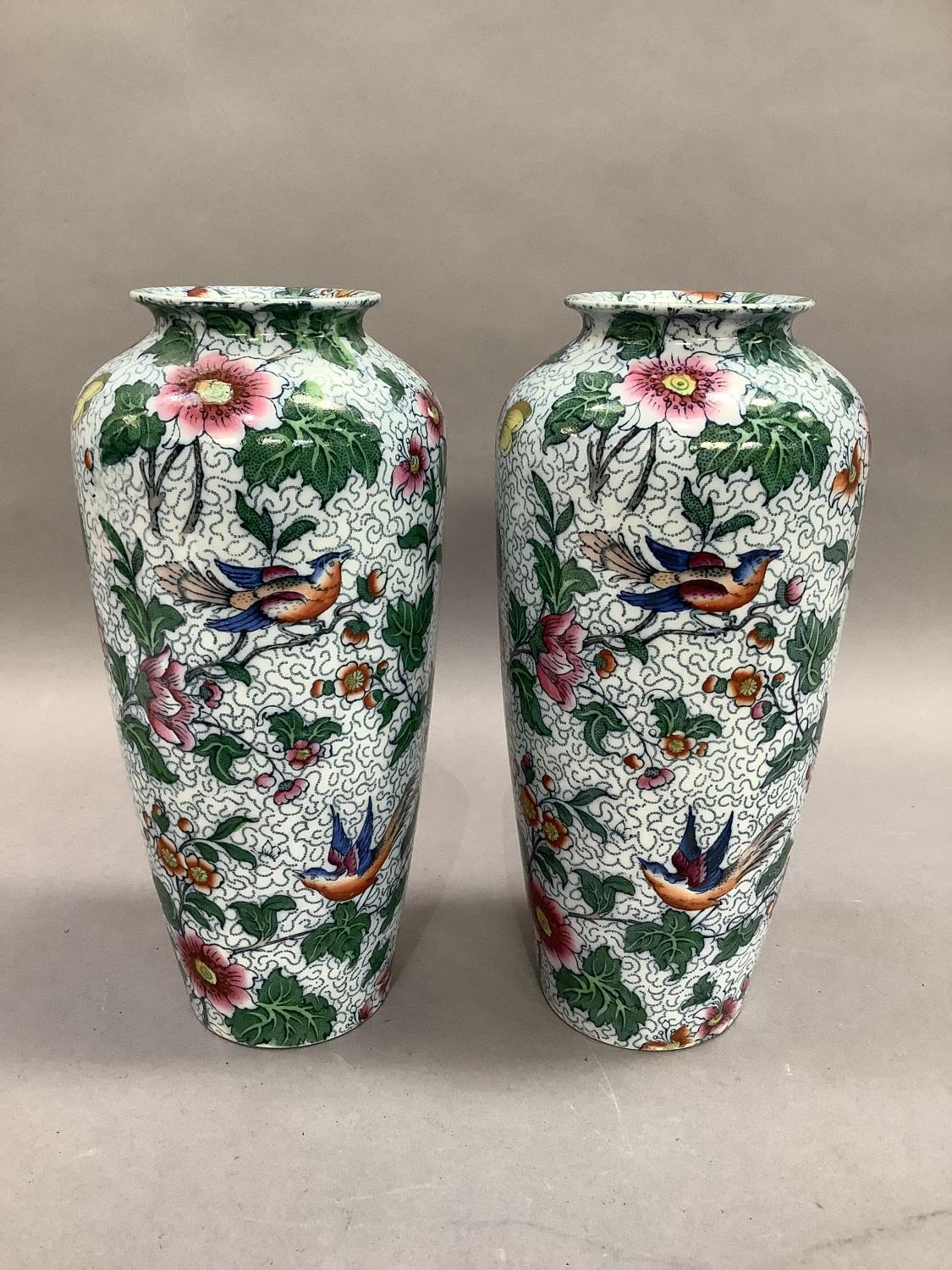 A pair of Losol ware vases of tapered cylindrical form, printed and enamelled with scattered