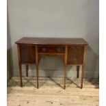 A George II style mahogany bow front sideboard, the top above a cock beaded central door and