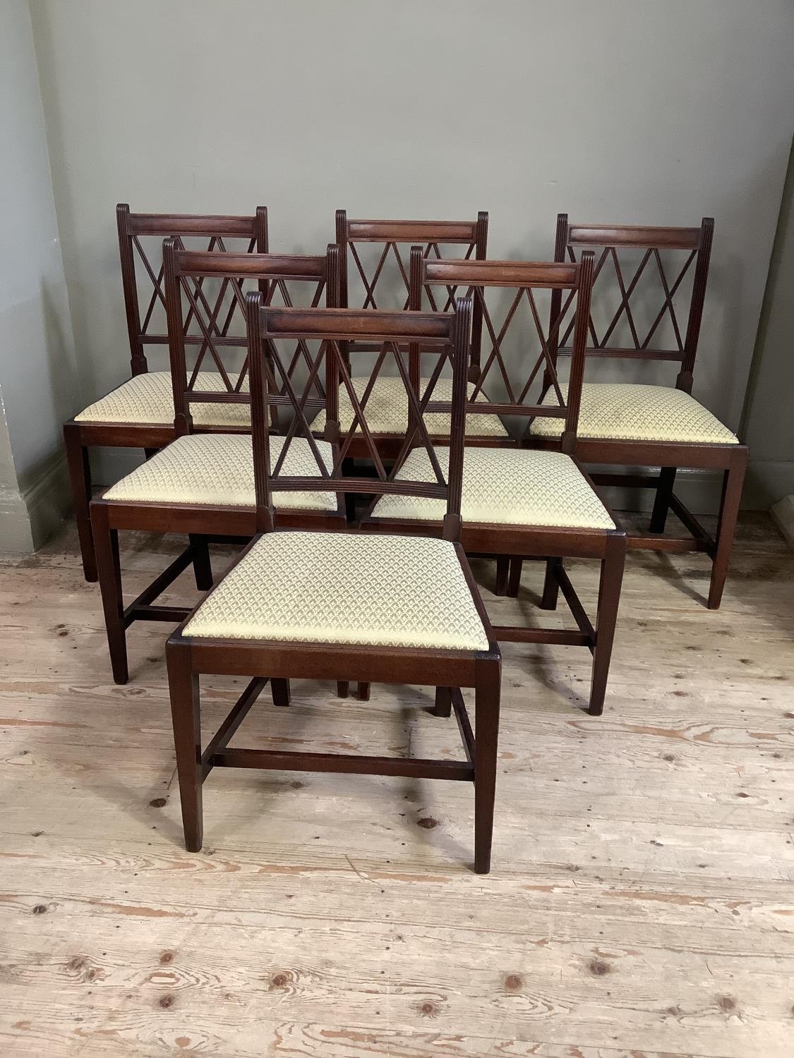 A set of six 19th century mahogany dining chairs, the reeded frames slightly concave tablet top