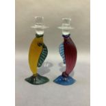 A pair of Murano style clear and coloured glass fish candlesticks, 29cm high