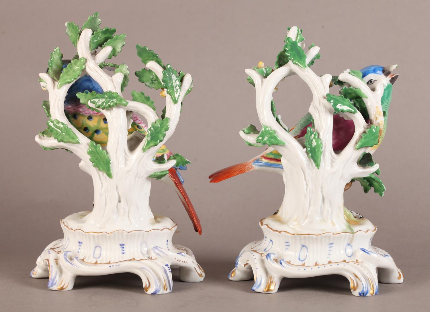 A pair of Continental porcelain figures modelled as a pair of colourful songbirds before leaf and - Image 4 of 4