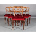 A SET OF SIX VICTORIAN MAHOGANY DINING CHAIRS with moulded kidney shaped backs, stuffed over seats