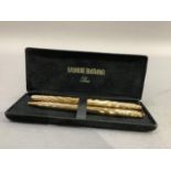 A Watermans rolled gold fountain pen with 18ct gold nib and matching ballpoint pen, in original box