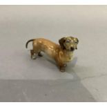 A Rosenthal figure of a Dachshund, 8cm high by approximately 15cm long