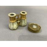 A pair of mother-of-pearl and gilt metal opera glasses together with a gilt metal jewel box of