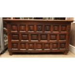 A SPANISH 17TH CENTURY CHESTNUT CHEST OF GEOMETRIC PANELLED FORM, hinged lid with moulded lip