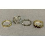 Four dress rings in silver and base metals