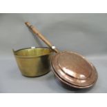 A brass jam pan with iron swing handle together with a copper warming pan on turned fruitwood handle