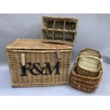 A wicker basket and a wicker bottle carrier, etc.