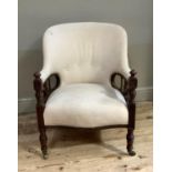 A Victorian mahogany framed tub chair, upholstered in buttoned beige fabric, the arms above