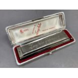 A Hohner Chromatic Harmonica, the Larry Adler Professional 16 in original case