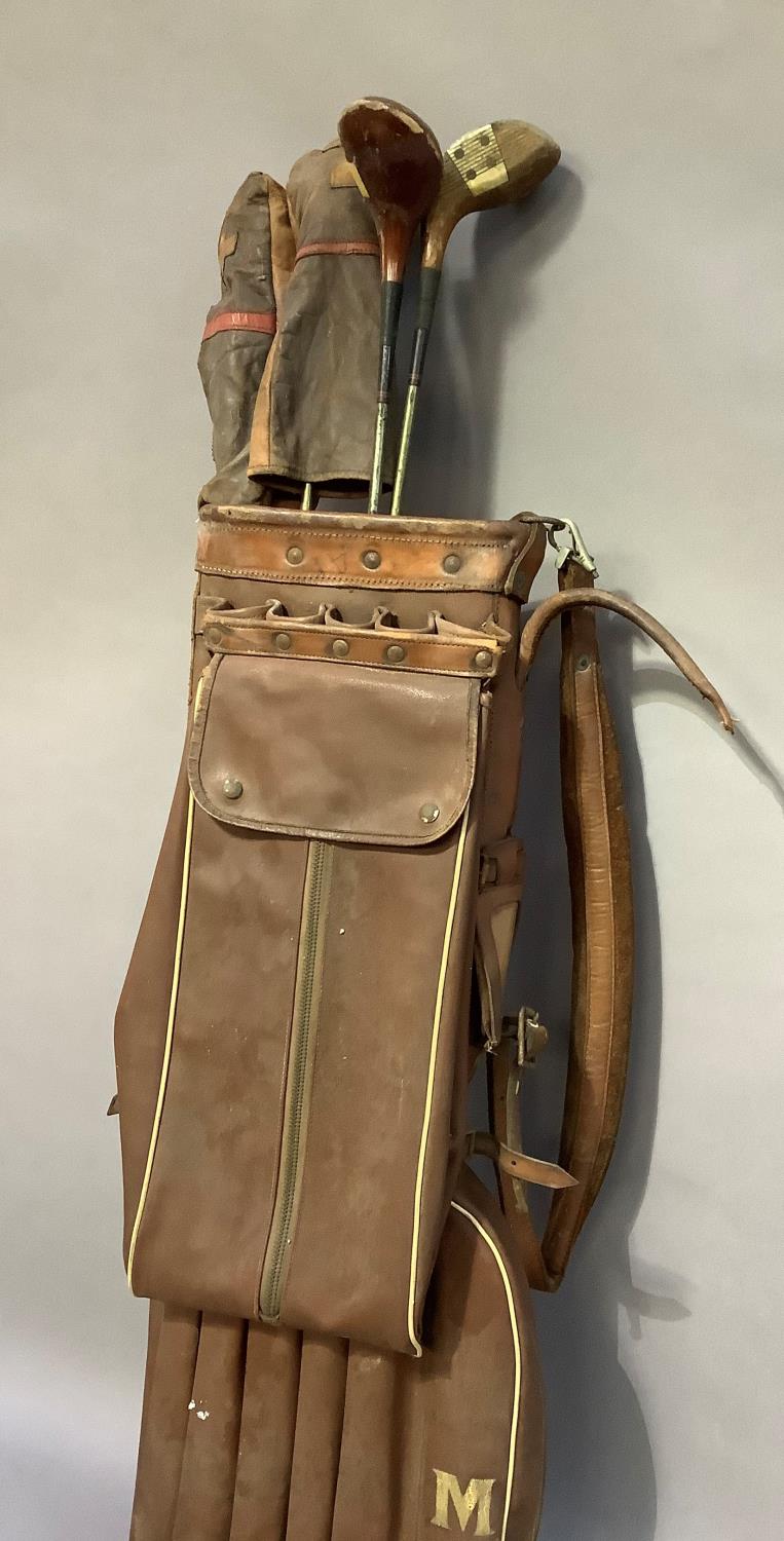 A vintage golf bag together with vintage clubs by Gradidge including drivers, two with leather - Image 2 of 4