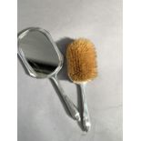 A silver and tortoiseshell backed hand mirror and hair brush, Birmingham 1913