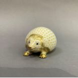 A Herend porcelain hedgehog in yellow, white and gilt, 9.5cm long