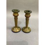 A pair of Chinese cloisonné candlesticks, the amber ground with floral sprays within blue scaled