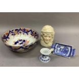 A Staffordshire chinoiserie style circular bowl decorated in underglaze blue and detailed in gilt