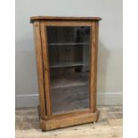 A Victorian burr walnut veneered music cabinet, outlined with boxwood stringing, the canted top