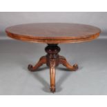 A VICTORIAN ROSEWOOD VENEERED CIRCULAR TABLE, the figured top above a bold turned column and three