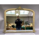 A reproduction gilt over mantel mirror in Victorian style with central foliate applied detail,