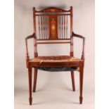 A LATE VICTORIAN MAHOGANY BEDROOM ELBOW CHAIR, boxwood strung, the shaped top rail inlaid with an