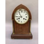 An Edward VII mahogany mantel clock with boxwood stringing, of lancet outline with brass rimmed