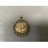 A Victorian 1894 veil head sovereign collet set as a pendant in 9ct gold within a pierced and beaded
