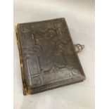 A Victorian leather bound musical photograph album containing numerous portrait photographs of