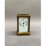A brass carriage clock by John W Fort of Manchester, 11.5cm high