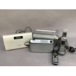 A Pure electric radio together with other radios, telephone handset, chargers etc