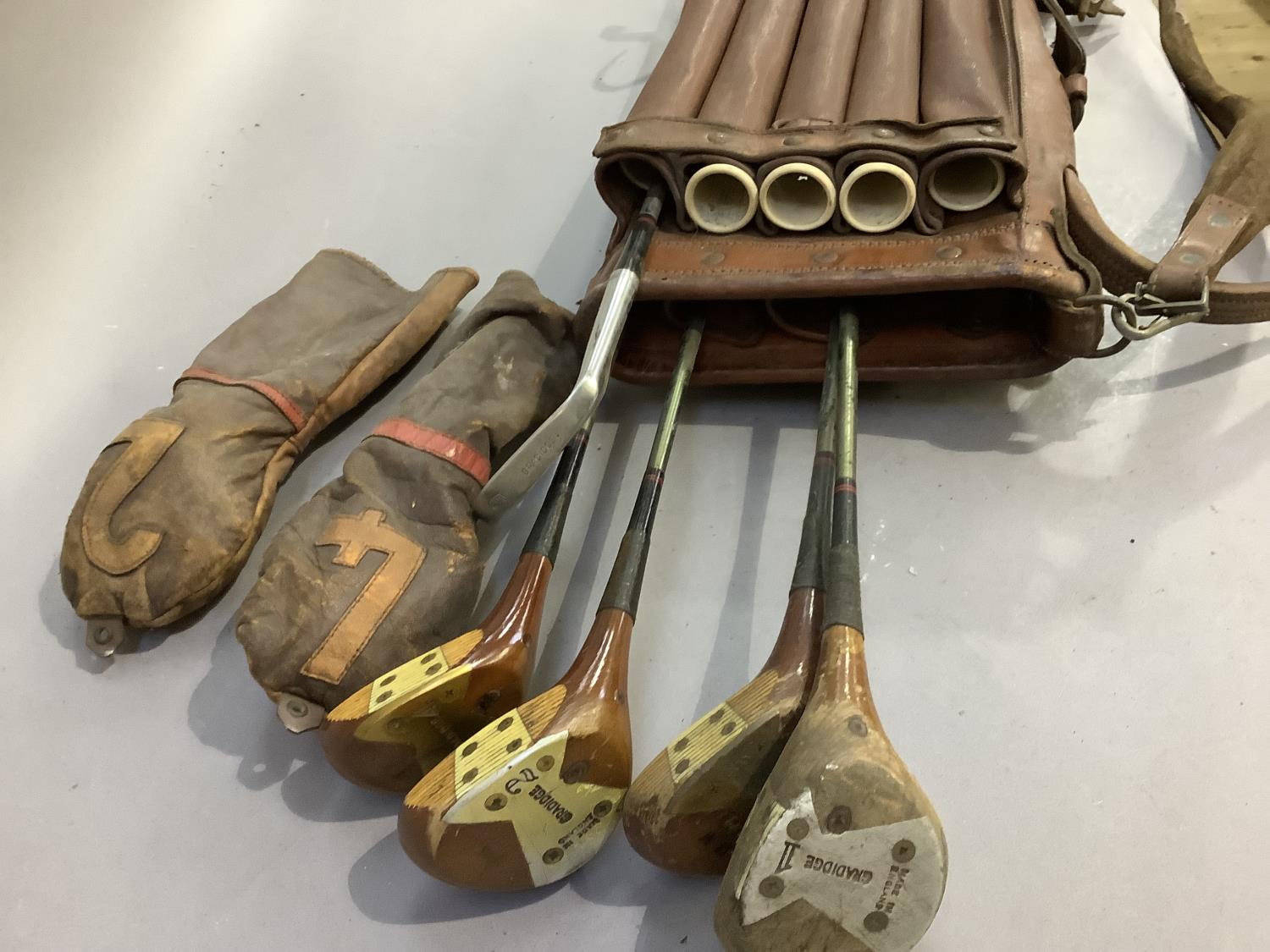 A vintage golf bag together with vintage clubs by Gradidge including drivers, two with leather - Image 3 of 4